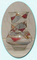 Mosaic Peglite nestled in Crystal Rain Sand inside the Tiffany Holder